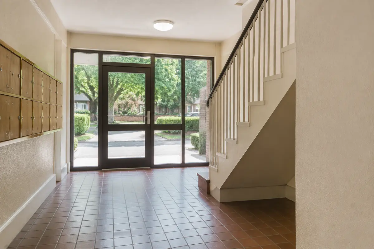 Clean shared entrance with stairs and resident access