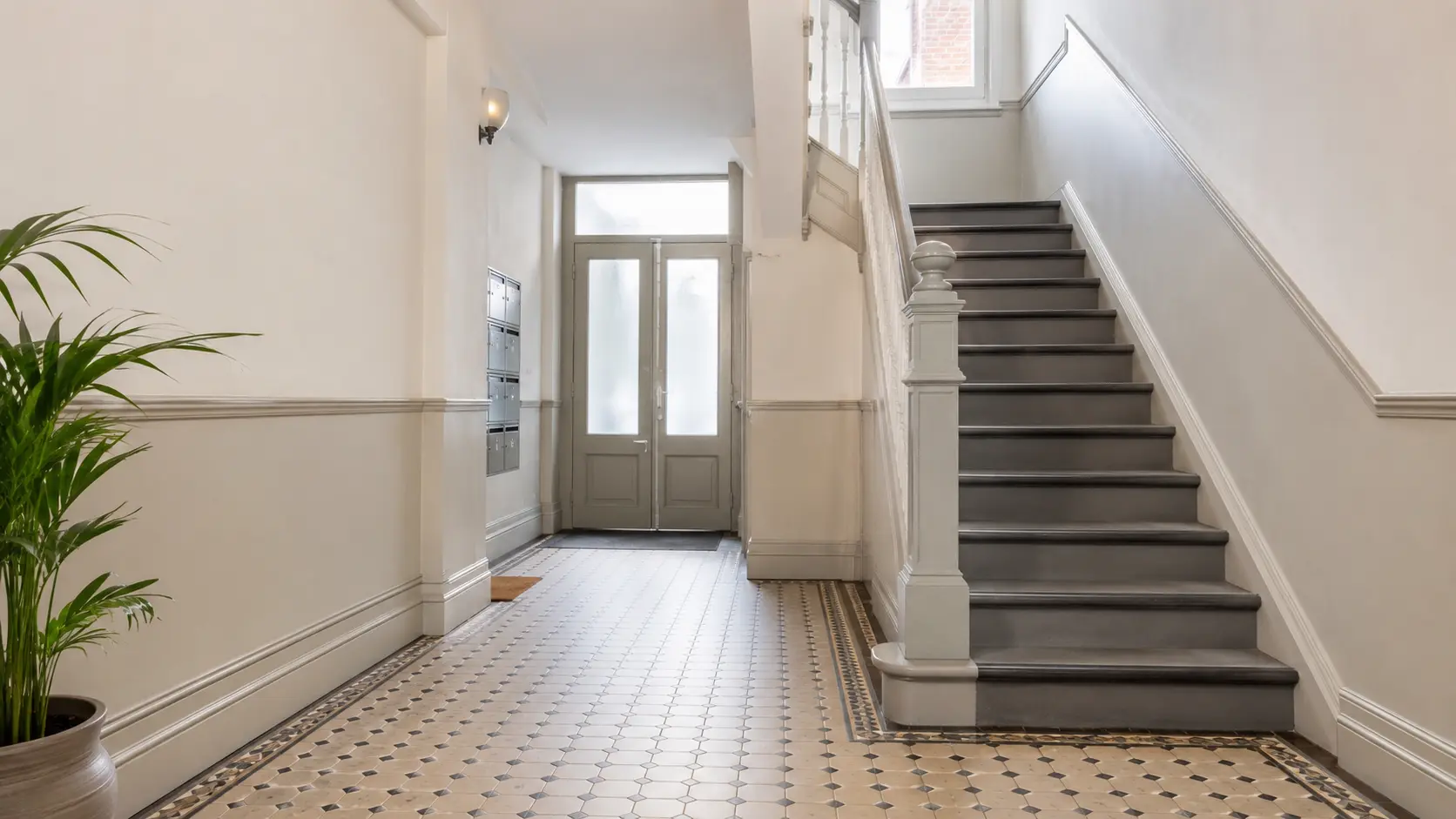 Clean communal entrance and staircase in a converted South London residential property